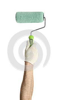 Man holding paint roller brush on white background, closeup