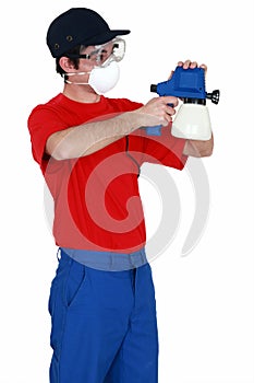 Man holding paint sprayer