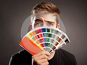 Man holding a pantone