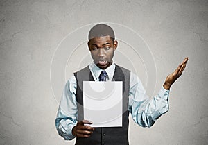 Man holding paper, statement, shocked with bad news