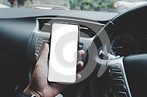 Man holding the phone in the car