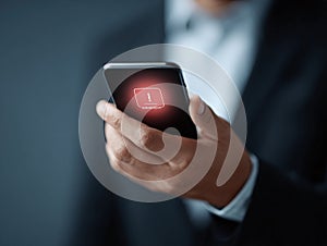 Man holding phone with glowing errorwarning. Symbolizes cybersecurity, system failure, or critical notification. Use for tech,