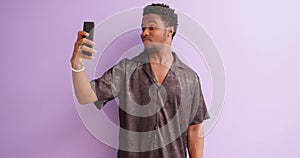 man holding phone, touching screen, taking photo