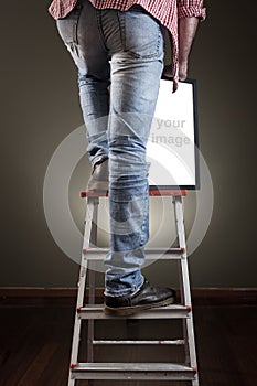 Man holding picture frame