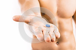 Man holding a pill used for Pre-Exposure Prophylaxis