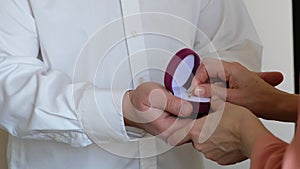 Man holding pink box with marriage engagement ring, preparation make proposal to loving woman, close up