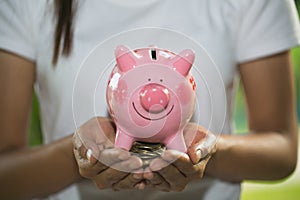 Man holding pink piggy bank, Save money and financial investment, financial or saving concept