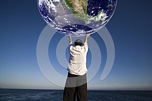 Man holding the planet earth