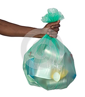 Man holding a plastic bag full of garbage