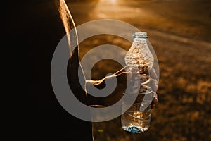 Man holding a plastic bottle