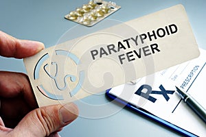 Man holding plate with sign Paratyphoid fever