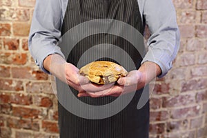 Man holding a pork pie
