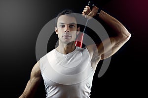 Man holding a power club behind his shoulder
