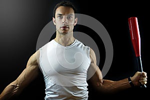 Man holding a power club on black background