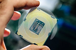 Man holding powerful CPU processor for computer