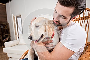 Man holding puppy