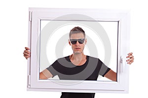 Man holding a pvc window frame