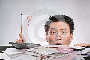 Man holding question mark flag