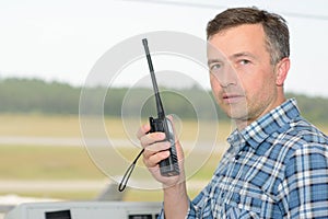 Man holding radio receiver