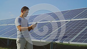 Man holding records of solar panels