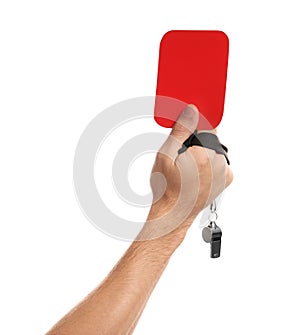 Man holding red card and whistle on white background