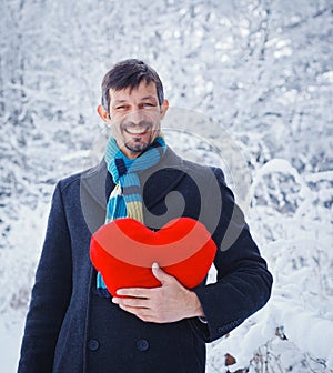 Man holding red heart