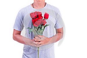 Man holding red rose flower. Valentines day and  Couples concept. Love and Flirting theme. Close up at rose. Body part and