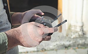 Man holding a remote control of drone