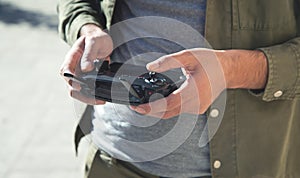 Man holding a remote control of drone