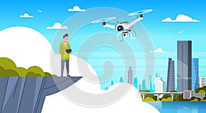 Man Holding Remote Controller For Modern Drone Fly Over City Buildings Background