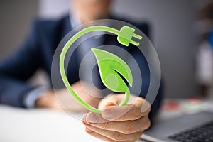 Man Holding Renewable Green Energy Concept photo