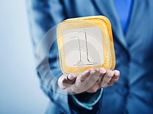 Man holding right-angled coin