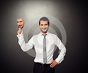 Man holding sad mask