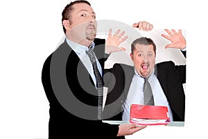 Man holding self-portrait