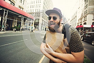 Man holding shopping bag in Soho, Manhattan, New York
