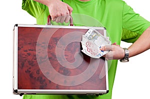 Man holding and showing a briefcase and money