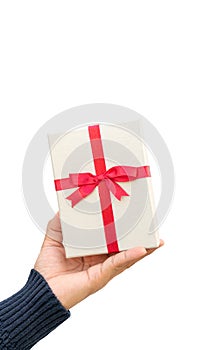 Man holding a silver gift box on a white background