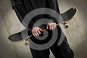 Man Holding Skateboard