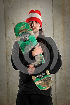 Man Holding Skateboard