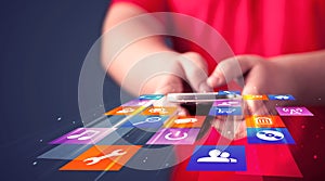 Man holding smart phone with colorful application icons