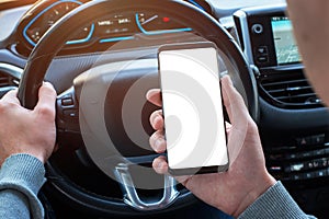 Man holding smartphone in car with isolated, white display for mockup, app, or web site design promotion