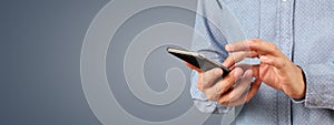 Man holding smartphone device touching screen