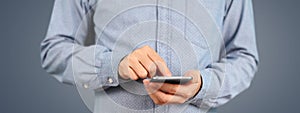 Man holding smartphone device touching screen