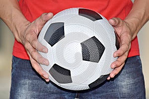 Man Holding Soccer Ball