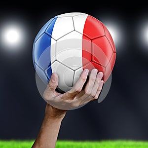 Man holding Soccer ball with French flag