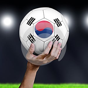 Man holding Soccer ball with South Korean flag