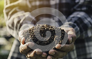 Man holding soil for planting in nature outdoor concept agriculture