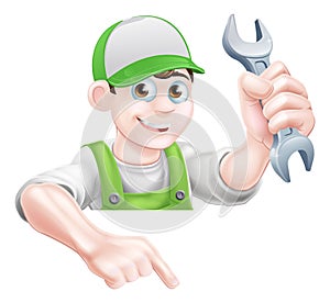 Man Holding Spanner and Pointing
