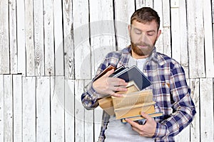 Man Holding Stack Of Books