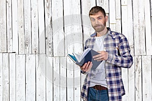 Man Holding Stack Of Books